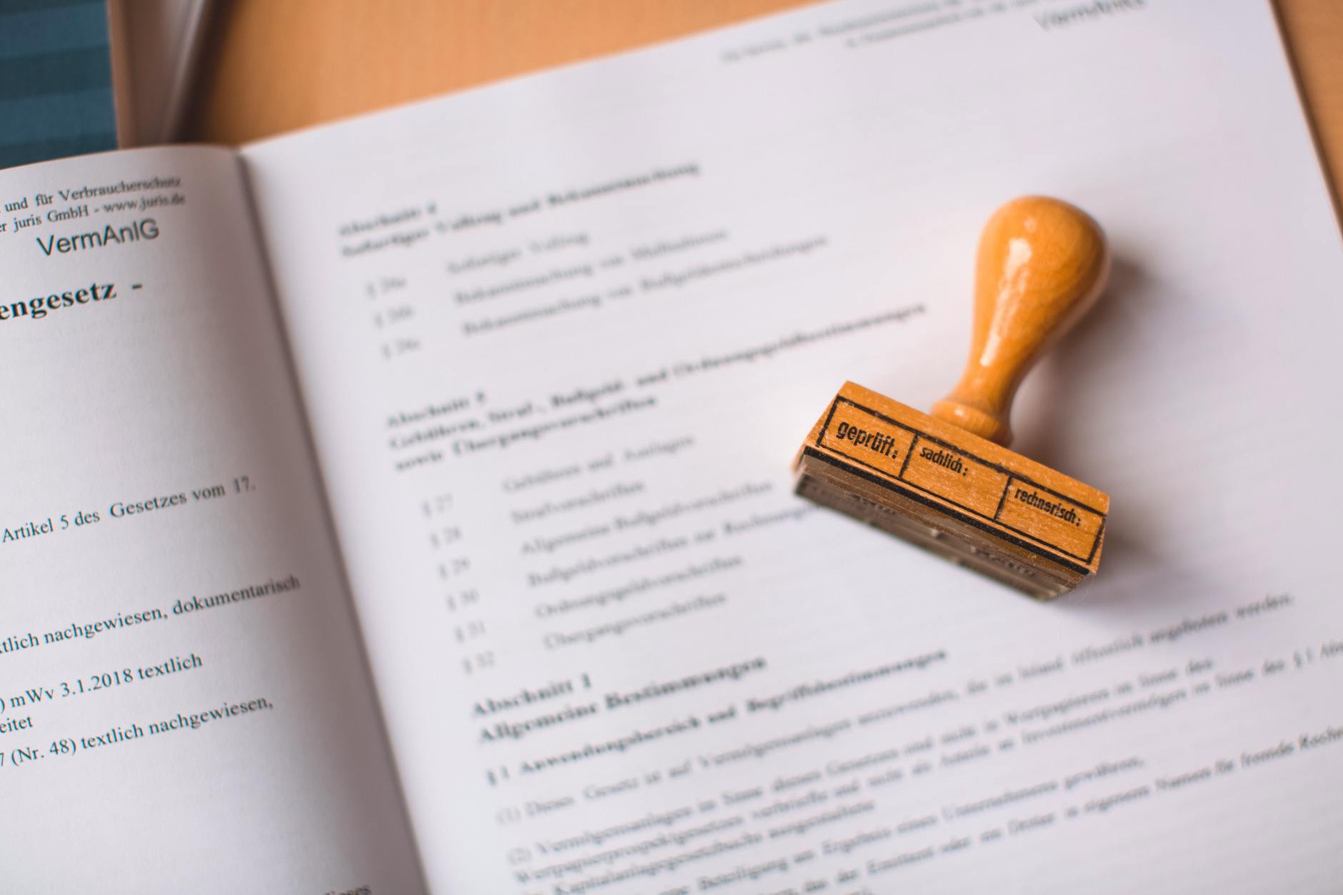 wooden stamp on an open book